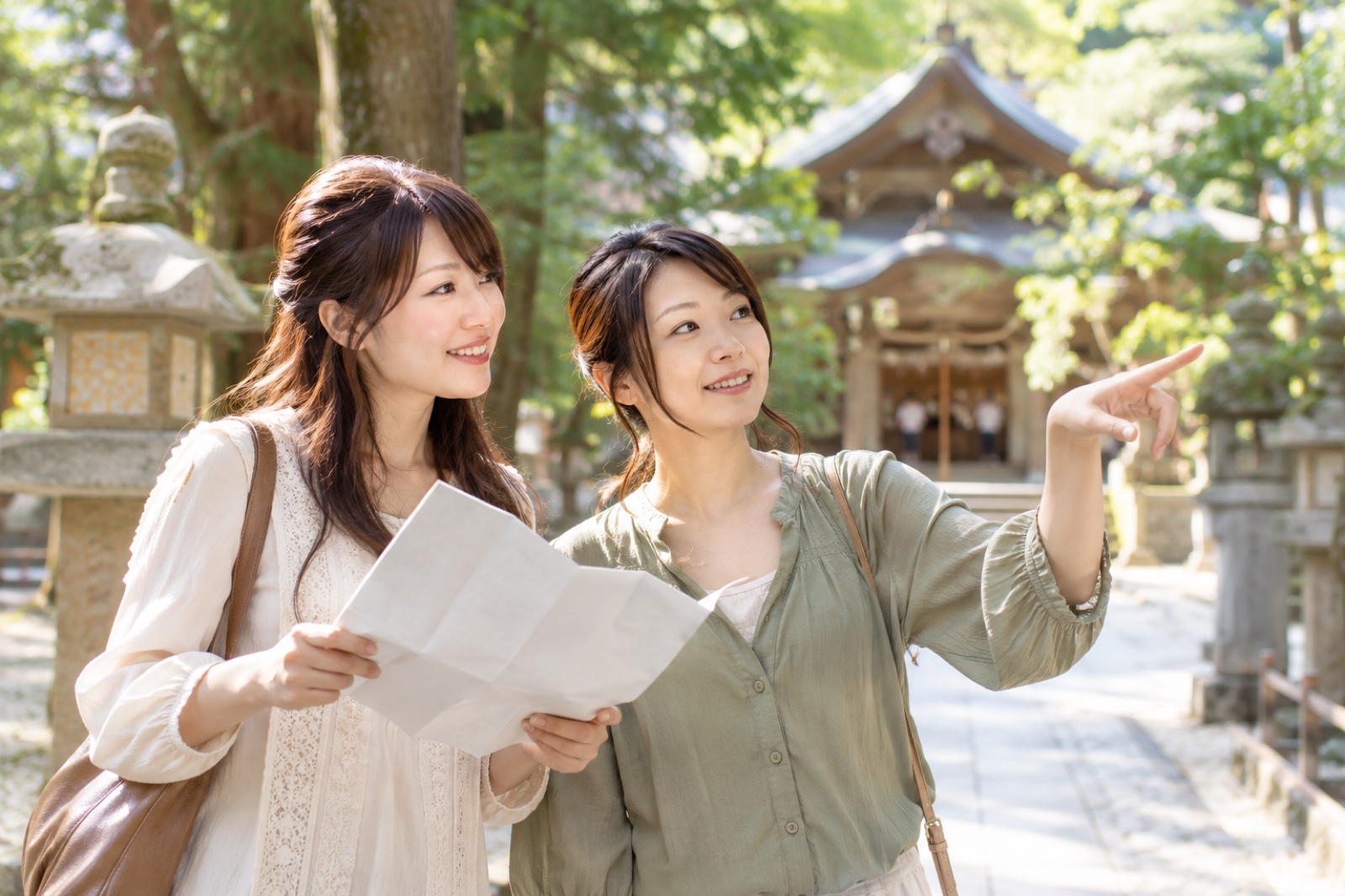 Women in 2008 visiting a related place with a map spread open
